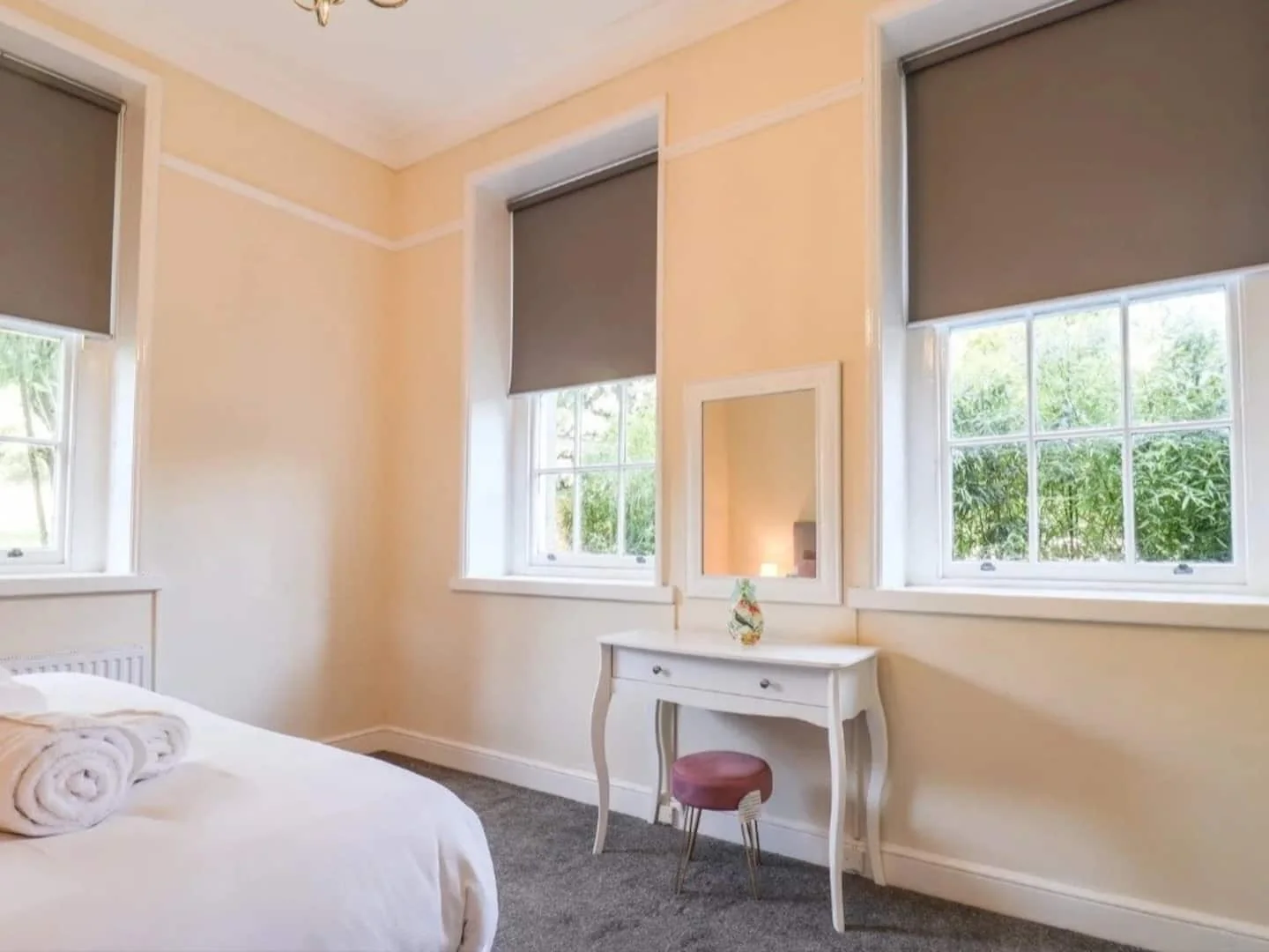 A bedroom in the estate's Airbnb accommodation with a double bed and period-style furnishings.