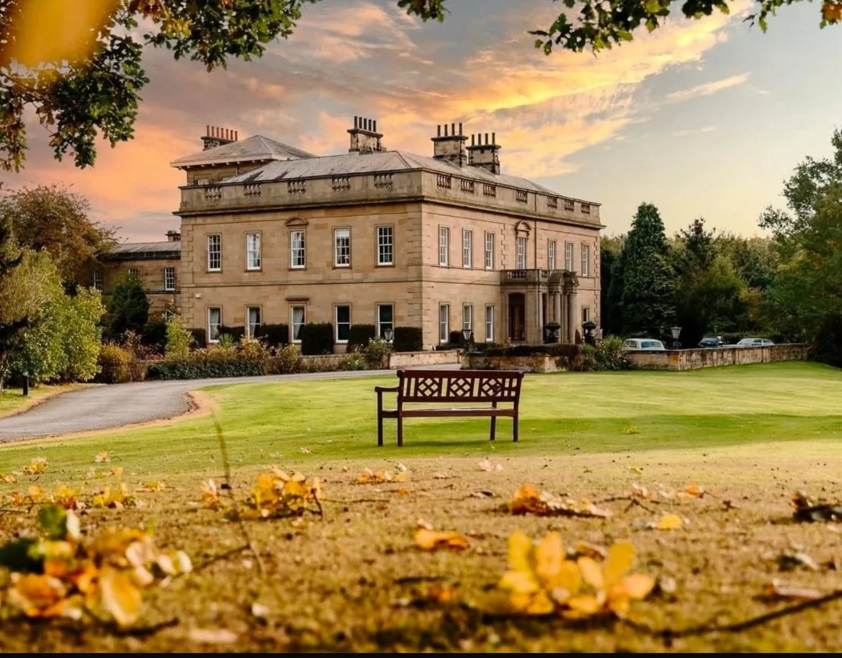 The sandstone frontage of Rudby Hall, framed by its North Yorkshire setting