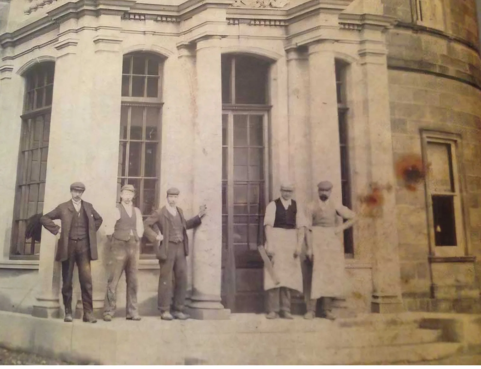 Archival photograph of people gathered outside the Hall's entrance.